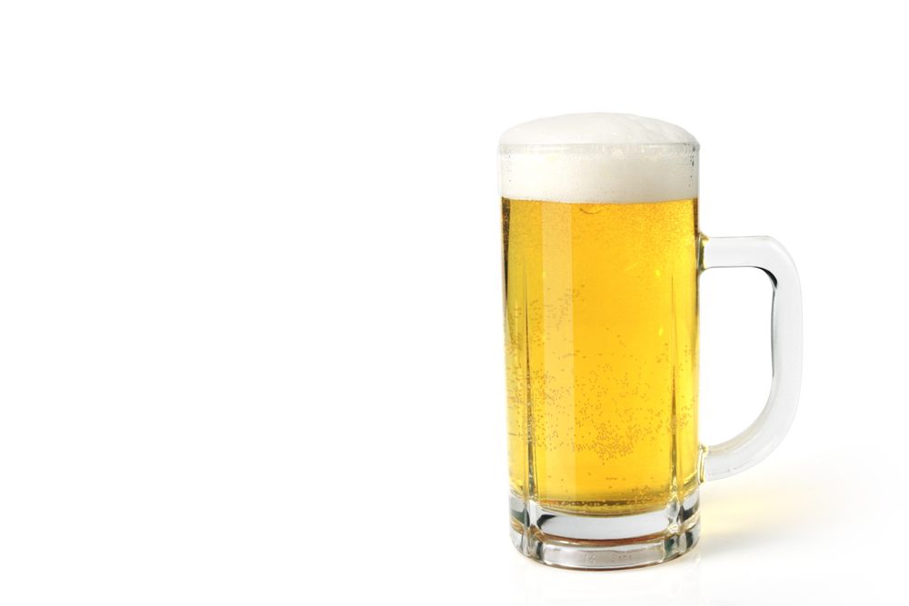 Glass of light beer set isolated on white background